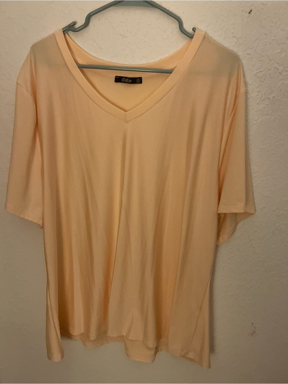 Lily Lightweight V-Neck Short Sleeve Tee in Light cream. 4x